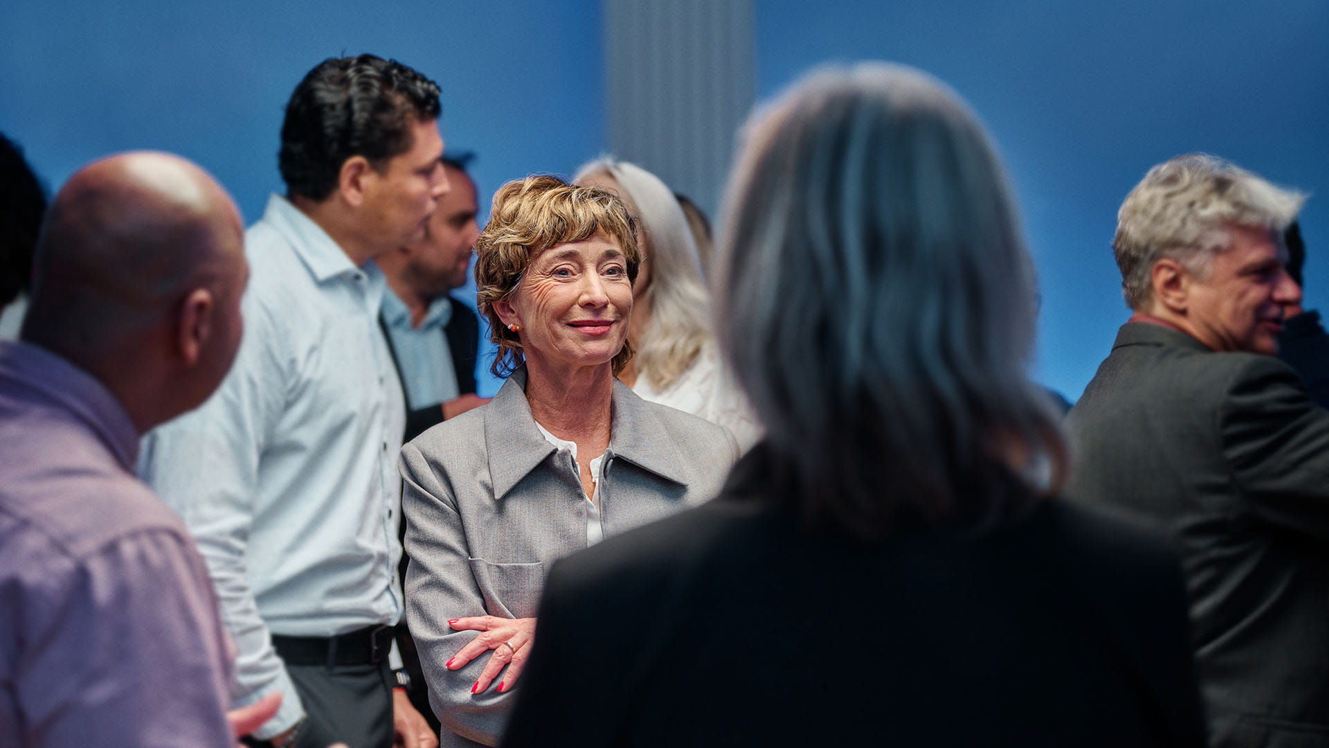 Woman in group conversation at a congress