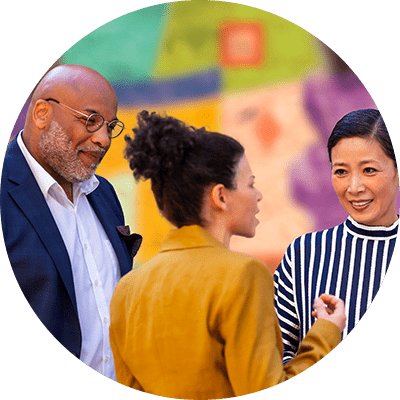 Artist explaining mural for other people